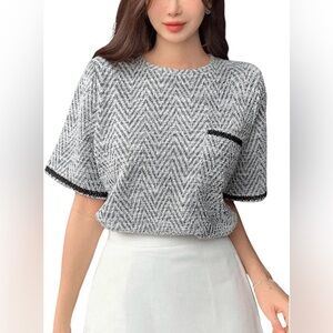 NWOT chic tweed style shorter length tee with front pocket and black floral trim